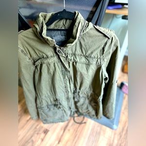 Weathered look military green jacket.